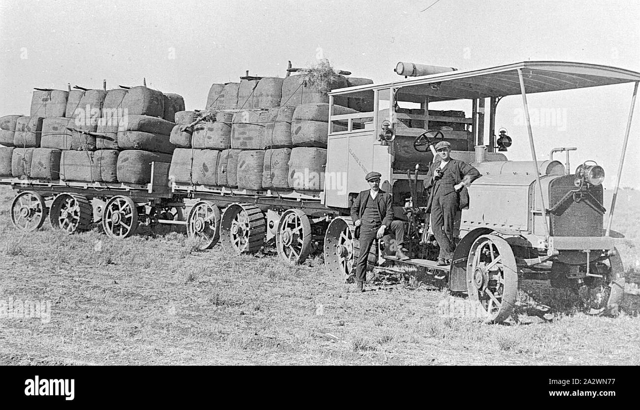 Negative - Transporting Wool Bales, 'Portland Downs' Station, Isisford District, Queensland, circa 1915, Two men with a tractor and wagons laden with wool bales at 'Portland Downs' station Stock Photo