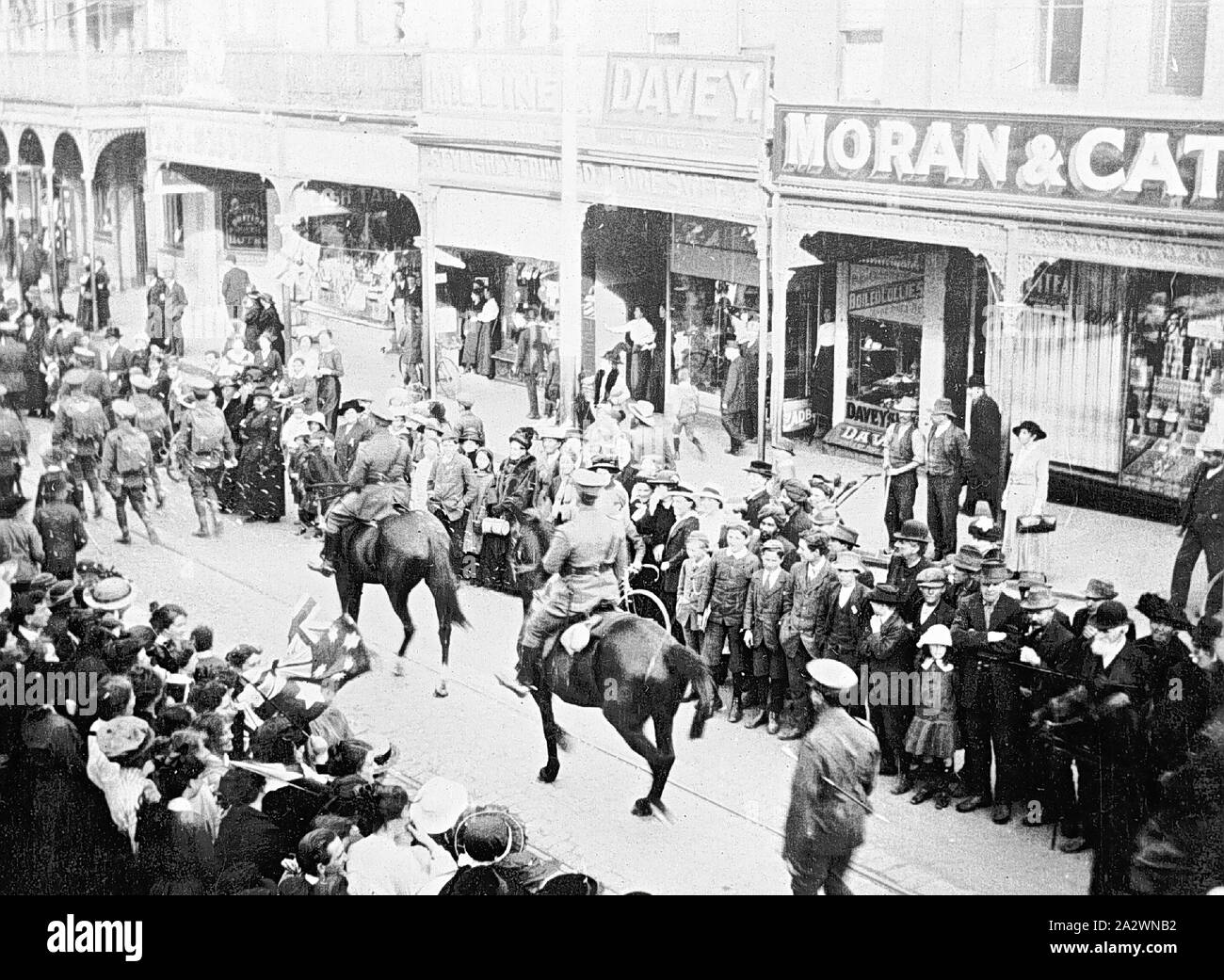 Negative - Parade of Soldiers of the 39th Battalion, Ballarat, Victoria, circa 1915, Soldiers of the 39th Battalion parading through Ballarat. There are two officers on horseback in the centre of the photograph Stock Photo