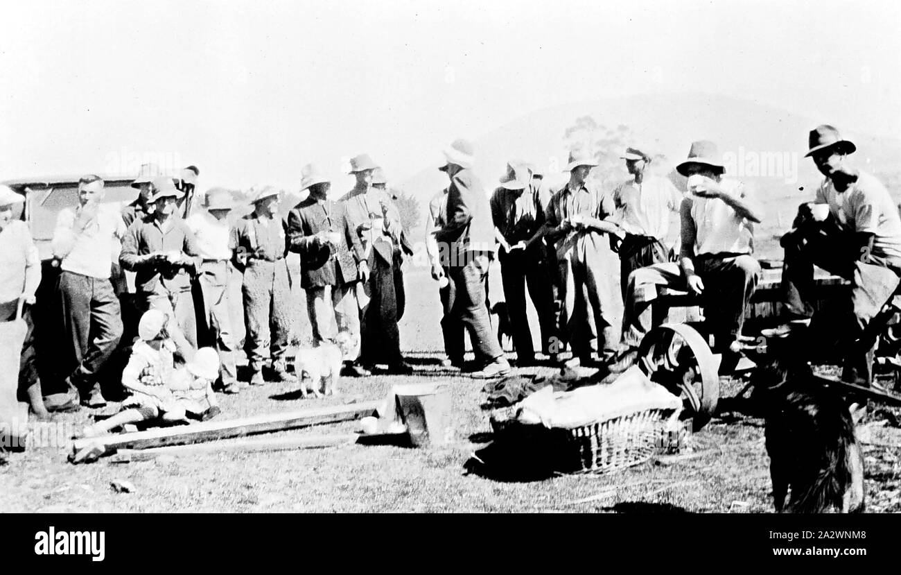 Negative - Dunnstown, Victoria, circa 1930, A thrasher machine crew on a tea break Stock Photo