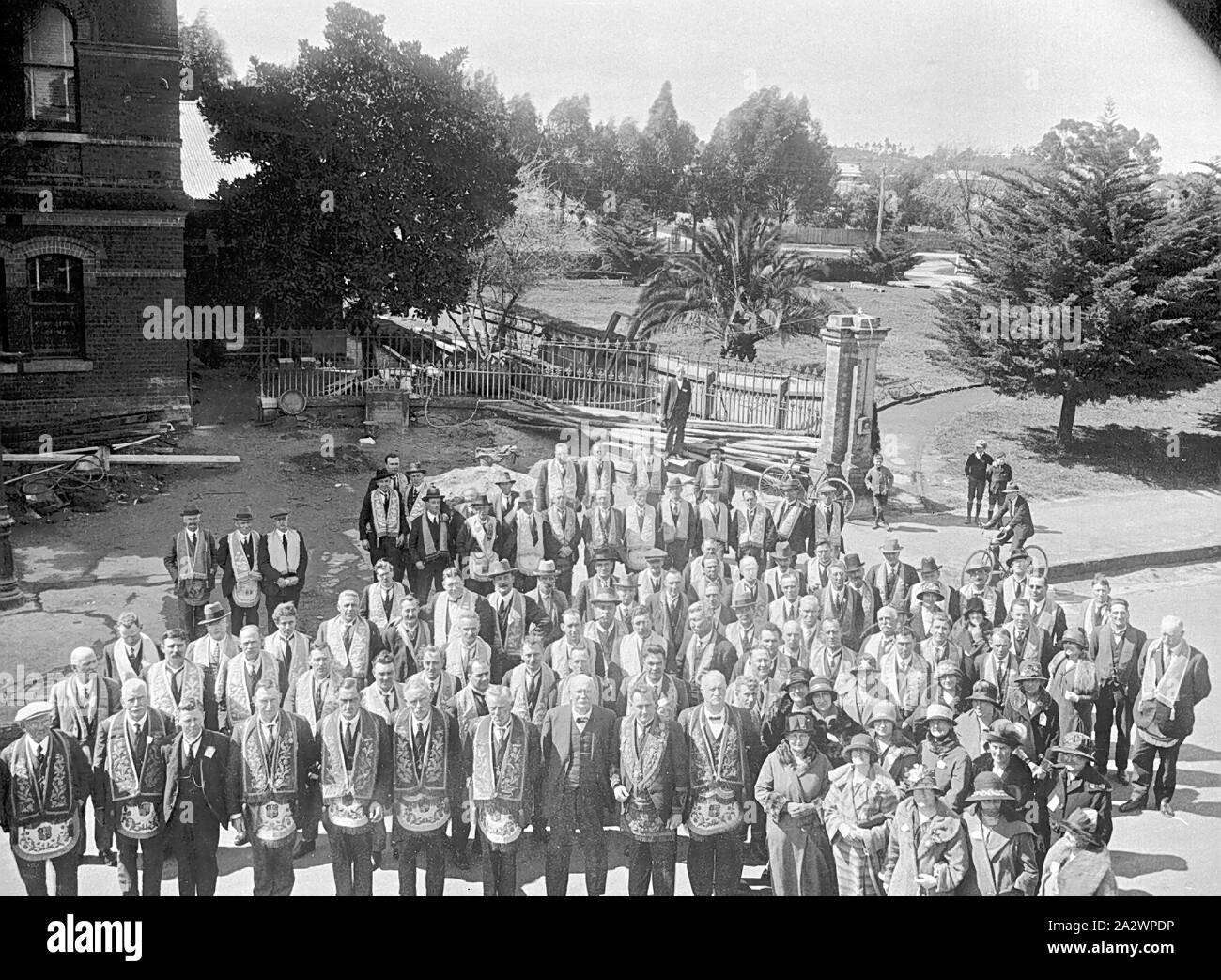 Negative - Eaglehawk, Victoria, circa 1910, A Masonic lodge gathering. The men stand on the left and a smaller group of women are on the right Stock Photo