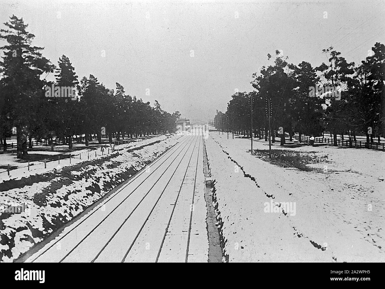 Negative - Ballarat, Victoria, Near Eureka Stockade Site, 1901, The railway line under snow on Christmas day, 1901. The Eureka Stockade is on the left, behind the houses Stock Photo