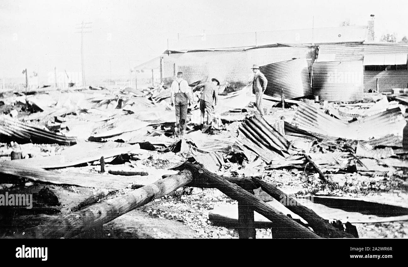 Negative - Burnt out shop, Manangatang, Victoria, 1933, On the 16th of March, 1933 a fire in the town of Mananatang destroyed three shops. This image shows the remains of one of the shops, Raphael's Store. It was reported in the Sydney Morning Herald the following day that due to the anbsence of any fire fighting equipment, and the poor water supply, handicapped fire-fighters. It was estimated that the fire caused between £8000 - £10000 damage Stock Photo