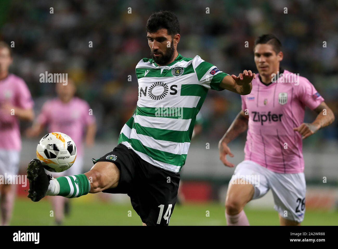 Lisbon, Portugal. 3rd Oct, 2019. Luis Neto of Sporting CP (L) vies with Dominik Frieser of LASK Linz during the UEFA Europa League Group D football match between Sporting CP and LASK Linz at Alvalade stadium in Lisbon, Portugal, on October 3, 2019. Credit: Pedro Fiuza/ZUMA Wire/Alamy Live News Stock Photo