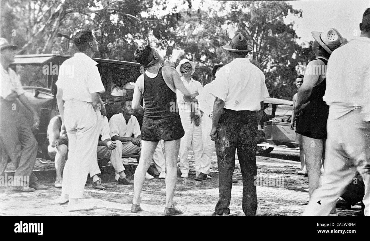 Negative - Euston District, New South Wales, circa 1925, A group of men playing two-up. Two of the men are in swimming costumes Stock Photo
