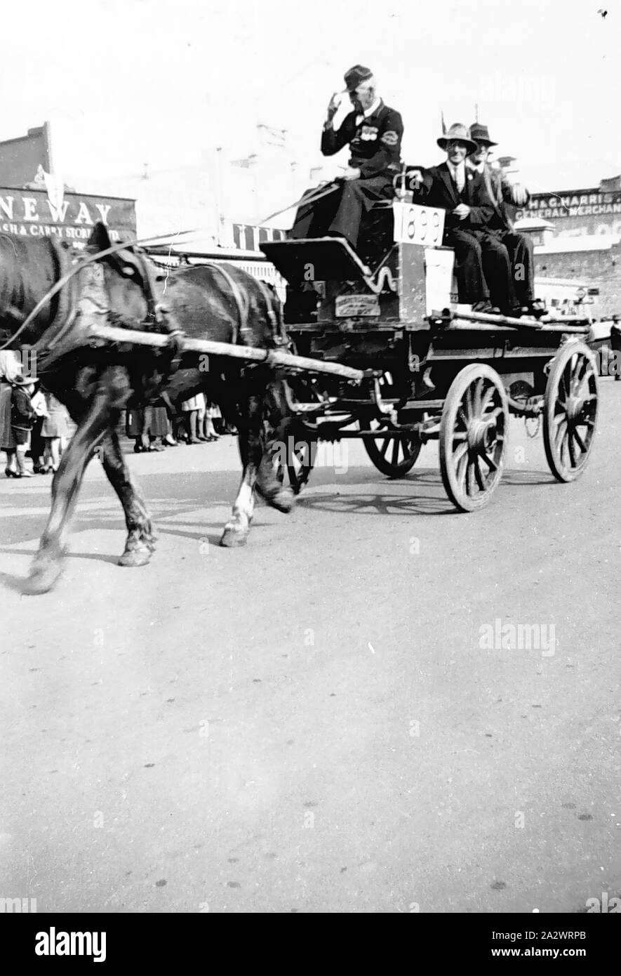 Negative - Casterton, Victoria, May 1937, An 1899 fire engine in the 1937  coronation procession. The men were all ex- firemen. The Neway Cash and  Carry in the background Stock Photo - Alamy