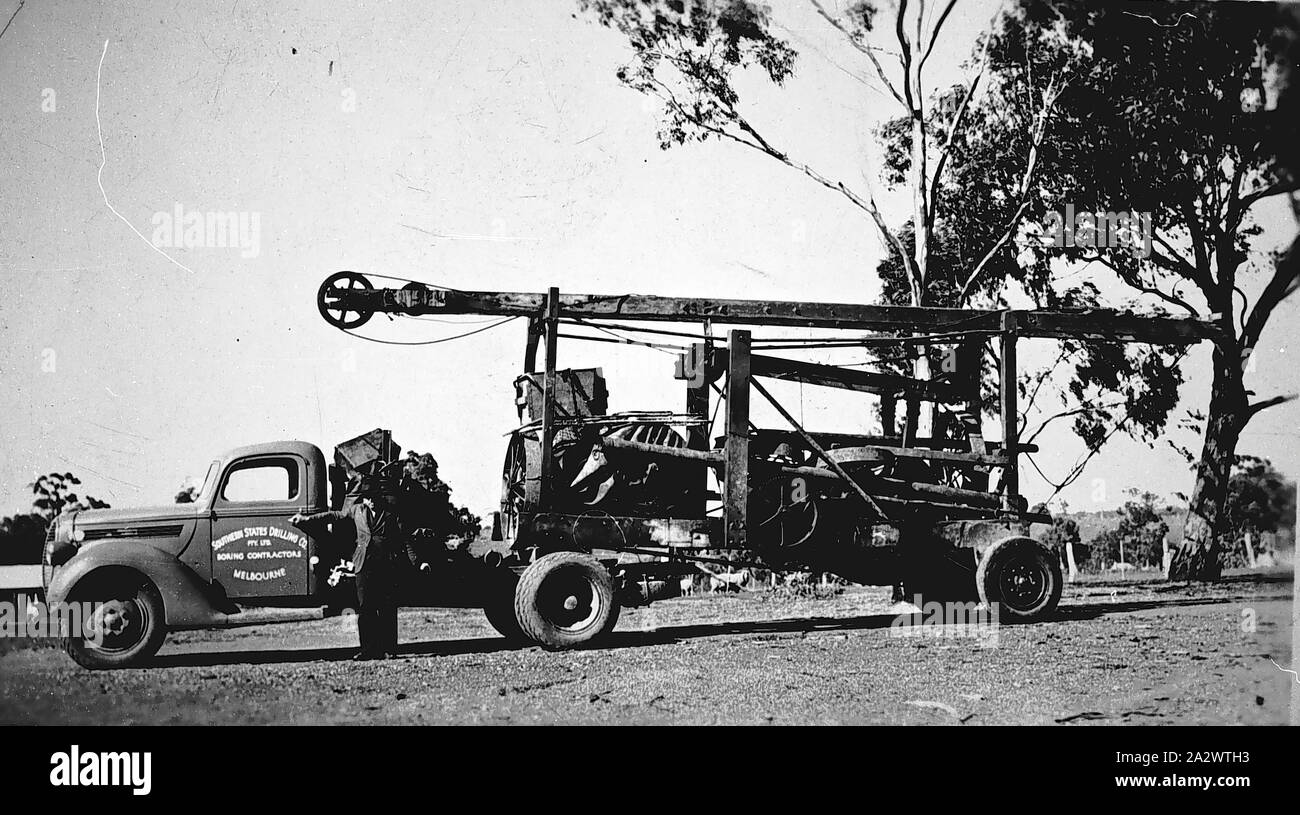 Negative - Albury District, New South Wales, circa 1937, A Ford truck belonging to the Southern States Drilling Company pulling a portable drilling rig Stock Photo