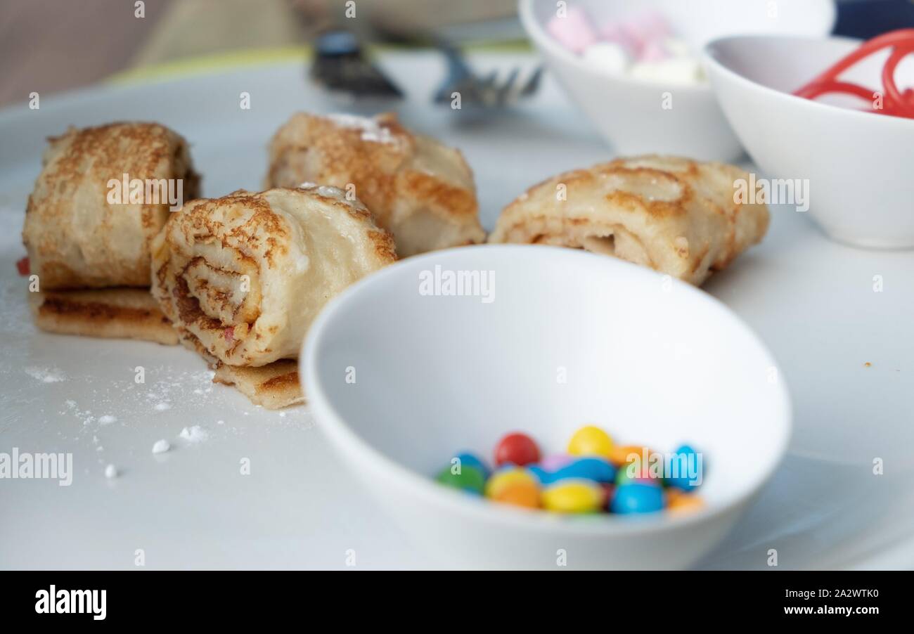 Fast food candy bar desserts during food festival. Crepes and langosi