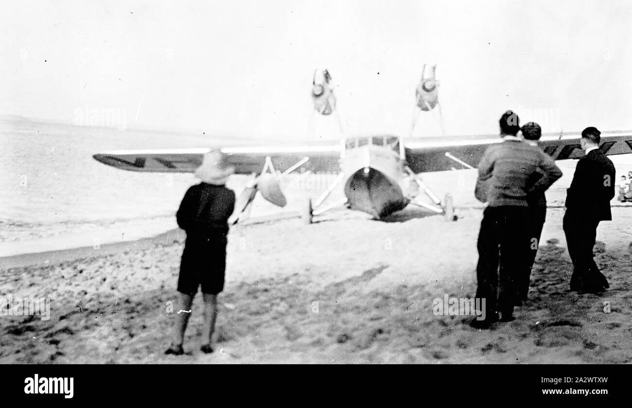 Negative - Saunders-Roe SARO A17 'Cutty Sark' Flying Boat on Beach, Cowes, Phillip Island, Victoria, 1933, The registration number partially visible on the underside of the wing suggests that this aircraft was the SARO A17/2 exported to Australia and registered as VH-UNV for Matthews Aviation Pty Ltd, the airline founded by Captain George Campbell Matthews (1884-1958) in 1930. The aircraft was imported in crates on the steamship 'Ballarat' and erected at Essendon Airport after its arrival in March Stock Photo