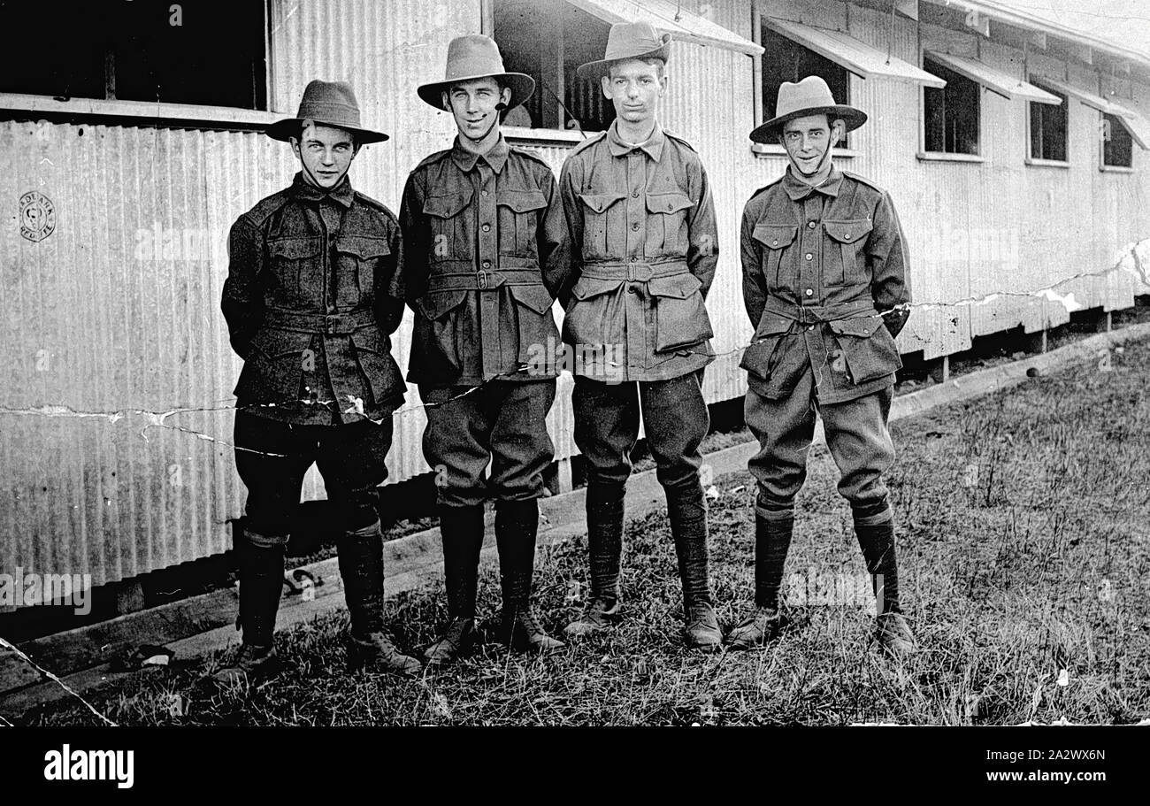 Negative - Four Soldiers Outside Barracks, Broadmeadows Army Camp, Victoria, circa 1914-1918, Four soldiers standing outside their barracks. The photograph is dated 1921, although the source of the date and place identification is unknown. It appears to be of World War I era Stock Photo