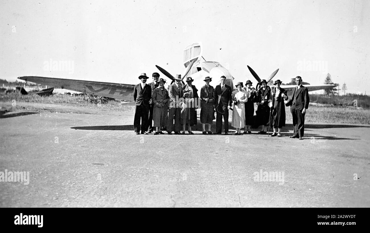 Negative - Mascot, New South Wales, circa 1935, A group of sightseers at Mascot Aerodrome about to board a flight to Bulli Pass. Monospar aircraft at rear Stock Photo