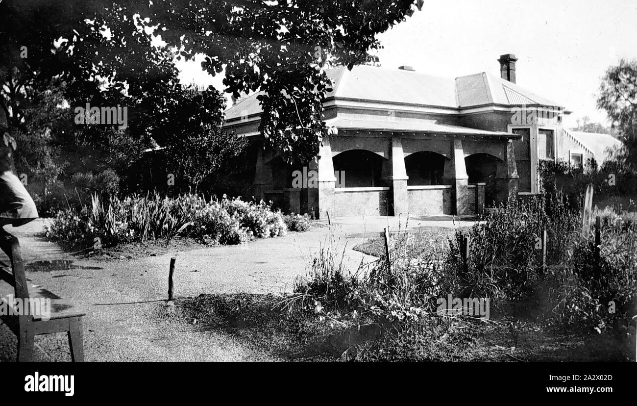 Negative - Kyneton, Victoria, circa 1928, A brick house and garden, with a solid return verandah. Established gardens at the front, with paths and a driveway leading to the house Stock Photo