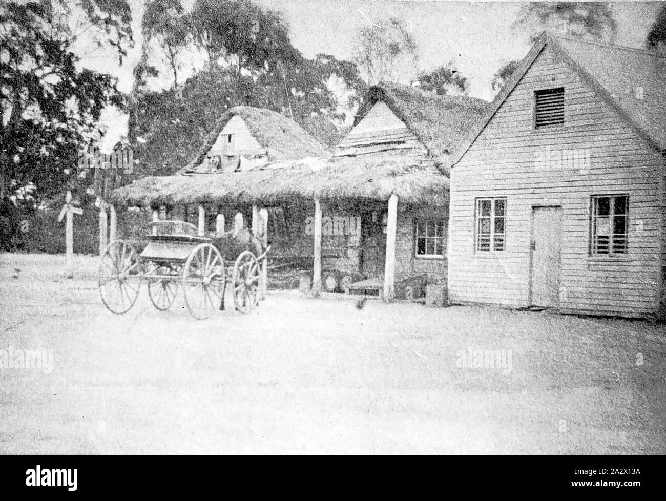 Negative - Eastville, Victoria, circa 1885, An early photograph of the Shootem Flying Inn with a thatched roof. There is a horse and cart in front of the inn Stock Photo