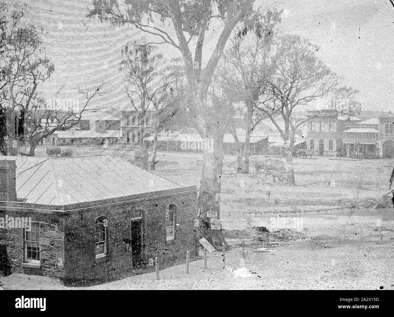 Negative - Bendigo, Victoria, 1857, There is a stone cottage in the foreground and the Bendigo Creek behind it. The Bendigo Hotel is among the buildings in the background Stock Photo