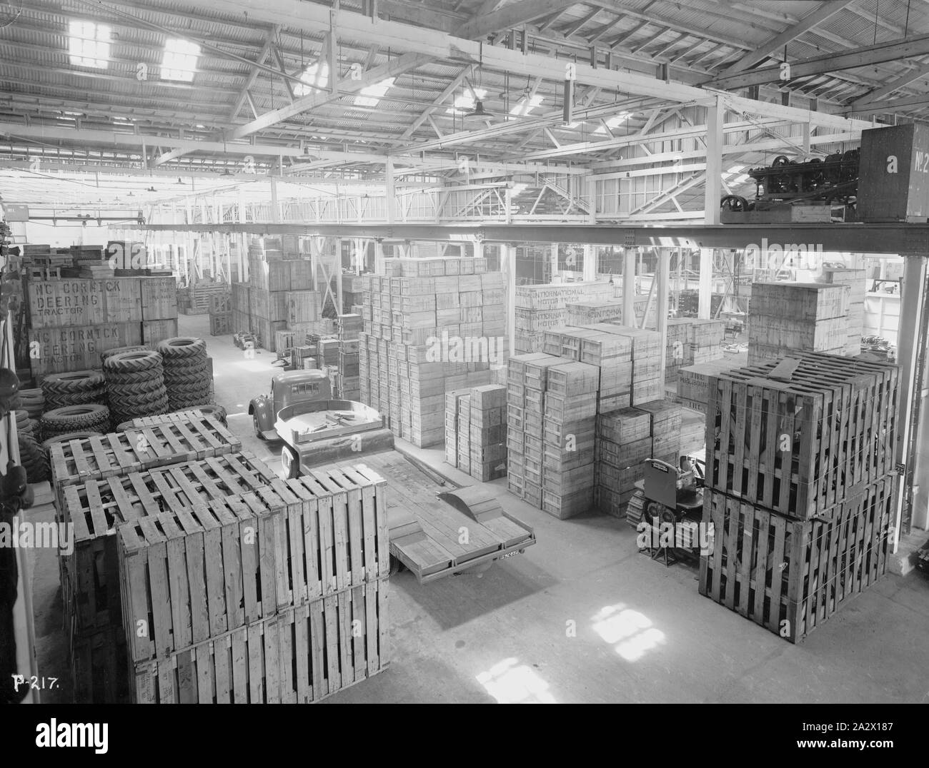 Negative - International Harvester, Interior of Machinery Warehouse, South Melbourne, Victoria, 1940, Part of a large collection of glass plate and film negatives, transparencies, photo albums, product catalogues, videos, motion picture films, company journals, advertisements and newspaper cuttings relating to the operations of the International Harvester Company and its subsidiaries in Australia. The International Harvester Company of America was formed in 1902 by the merger of five leading Stock Photo