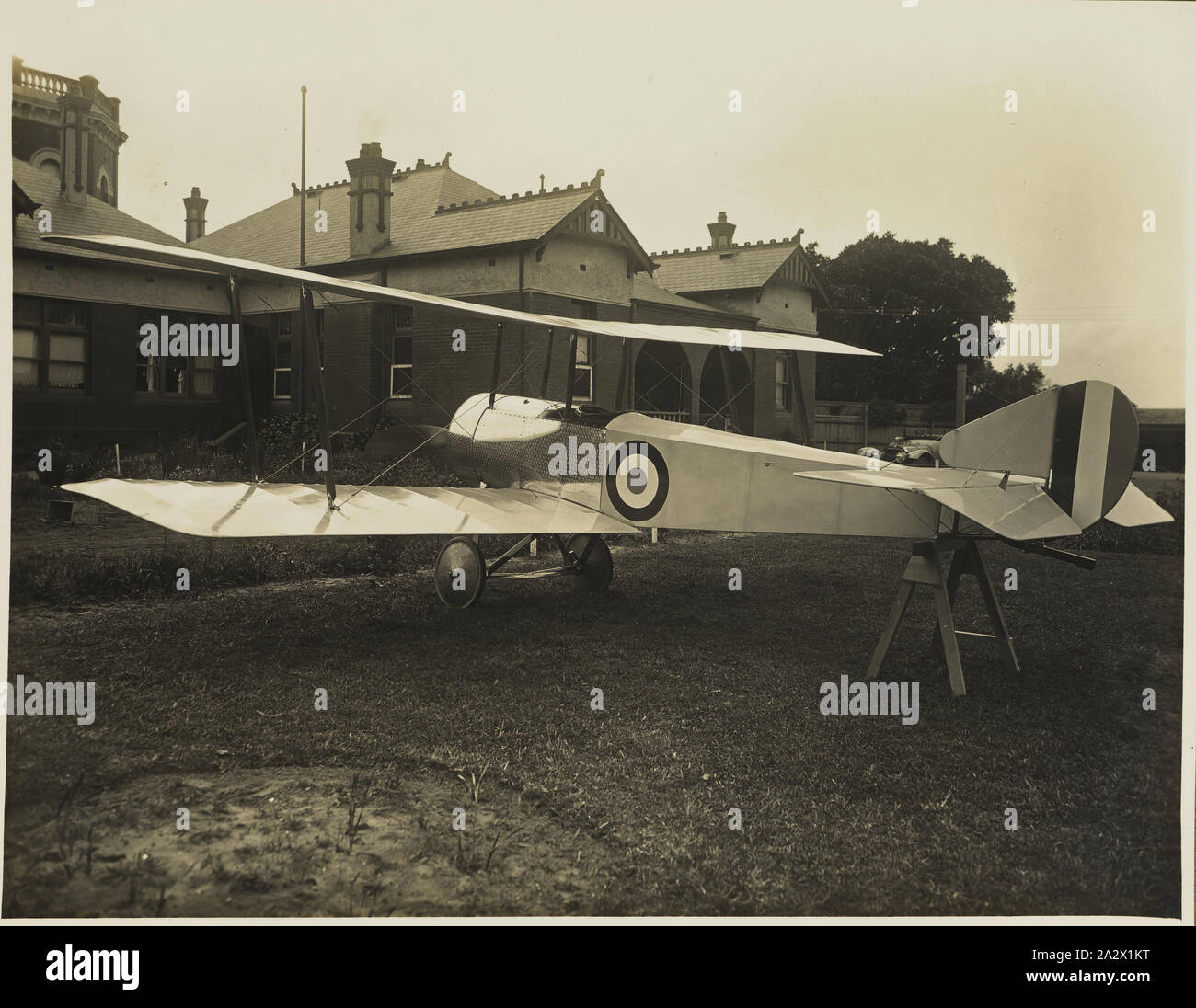 Photograph - Oblique Left Rear View of Basil Watson's Biplane on the Rear Lawn Outside 'Foilacleugh', Elsternwick, Victoria, 1916, Part of a commemorative photograph album produced by Sears' Studios, Melbourne, documenting the work of Basil Watson in constructing a biplane at his family's home 'Foilacleugh' in Elsternwick, Victoria, during 1916, and the aftermath of his fatal crash off Point Cook on 28 March 1917. The biplane was based on the design of the Sopwith Pup Stock Photo