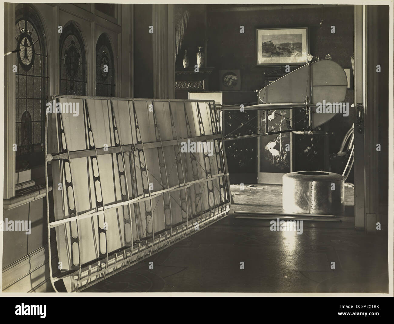 Photograph - Partially Constructed Wing, Fuselage & Engine Cowling of Basil Watson's Biplane in the Family Home, Elsternwick, Victoria, 1916, Part of a commemorative photograph album produced by Sears' Studios, Melbourne, documenting the work of Basil Watson in constructing a biplane at his family's home 'Foilacleugh' in Elsternwick, Victoria, during 1916, and the aftermath of his fatal crash off Point Cook on 28th March 1917. The biplane was based on the design of the Sopwith Pup Stock Photo