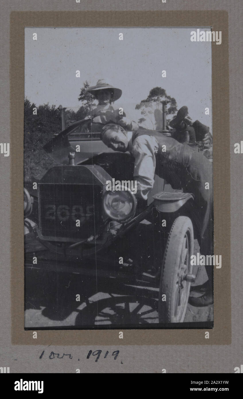 Photograph - Creswick Tour, Australia, Sergeant Major G.P. Mulcahy, 1919, One of 44 black and white photographs in an album bound in green suede, believed to have been taken by Sergeant Major Gilbert Payne Mulcahy during World War I. It documents his military service in Egypt, France, Belgium and his return to Australia via Capetown and the Quarantine Station, Point Nepean, 1916-1919. Image of an unknown man and woman with a Ford Model T automobile Stock Photo