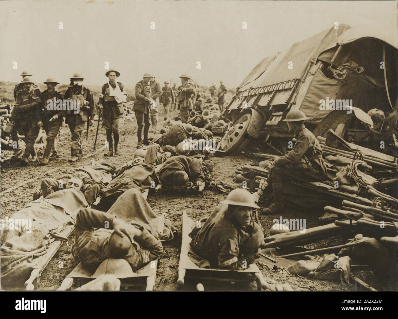 Photograph - 'After the Battle of Menin Road', World War 1, Ypres, Belgium, 20 Sep 1917, Photograph of the aftermath of the Battle of Ypres, Belgium, Word war I. The Australian War Memorial holds the same photograph (E00711) which it identifies as depicting 'a scene on the Menin Road near Hooge, looking towards Birr Cross Roads, during the battle on 20 September 1917'. It explains that the wounded on stretchers were waiting to be taken to casualty clearing stations. Soon after Stock Photo