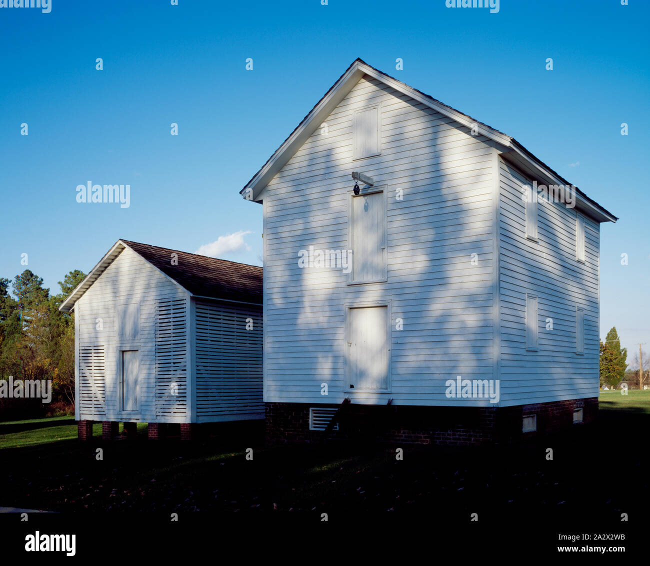 Restored corn crib and smaller building on the Edwin Holt Plantation in Alamance County, North