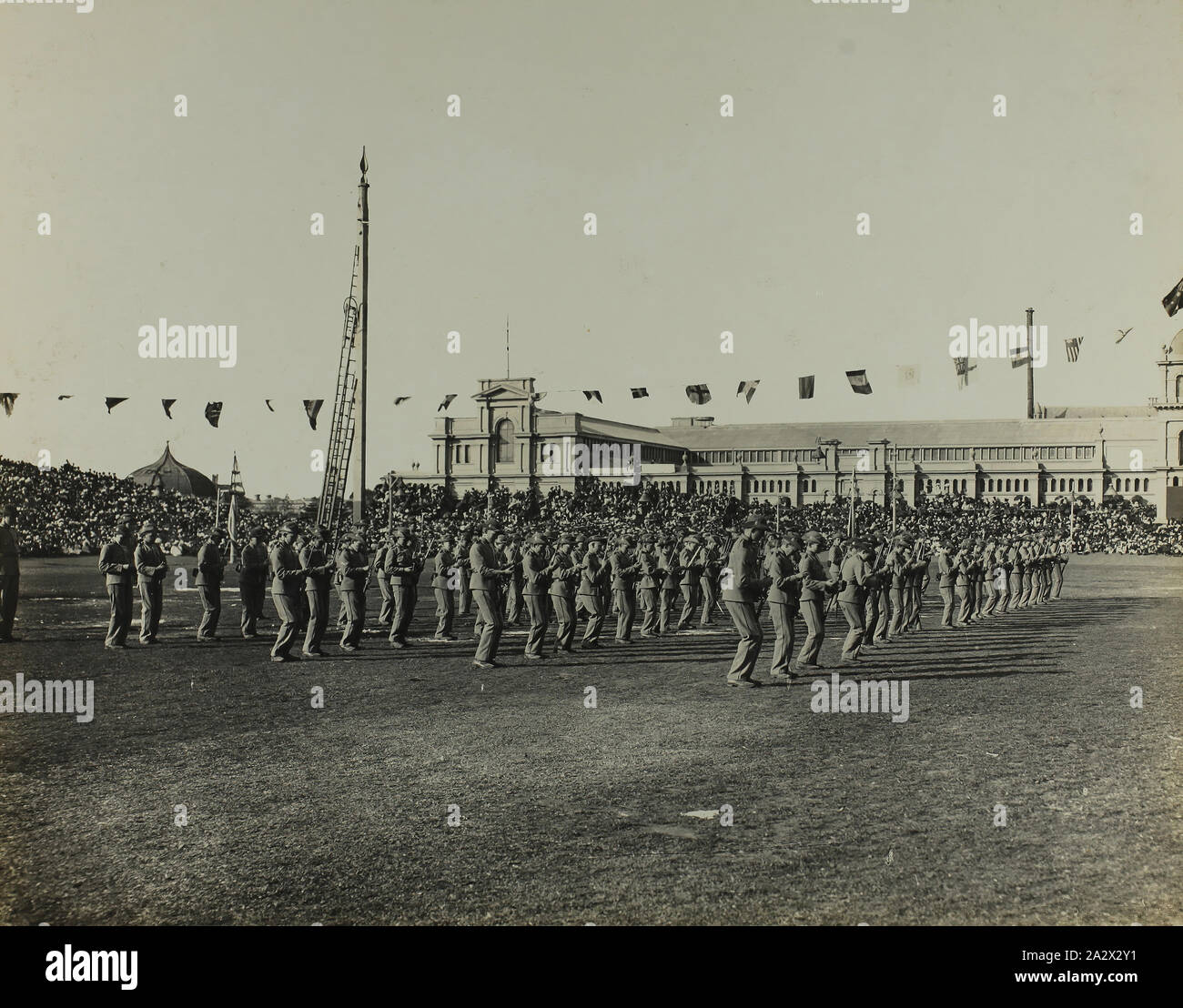 Photograph - 'State School Fete, Exhibition Building, Cadets at Drill', Melbourne, 11 May 1901, One of a set of 47 original photographs of the Australian Federation celebrations in Melbourne 1901 to mark the opening of the first Federal Parliament of Australia. The photographs trace the Royal Visit of the Duke and Duchess of Cornwall and York for the occasion, from their arrival in Melbourne on the Royal Yacht 'Ophir' at St Kilda Pier on 6 May 1901 to their departure for Brisbane at Port Stock Photo