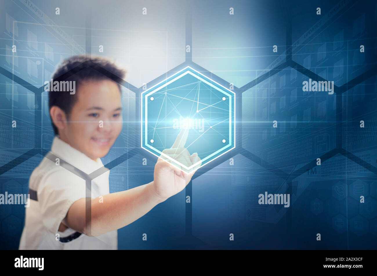A Young Man Touching a Hexagon Plate Virtual Button On a Virtual Hologram Screen. Modern Technology and Futuristic Concept. Stock Photo