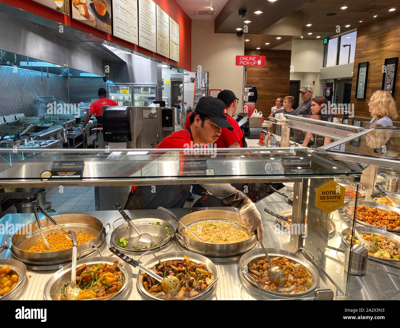 Orlando,FL/USA-10/2/19: Panda Express chinese fast food restaurant employees waiting on customers. Stock Photo