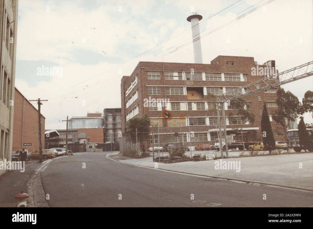 Photograph, Former Kodak Factory Buildings on Southampton Crescent, Abbotsford, Victoria, Feb 1982, Colour photograph of former Kodak Abbotsford factory taken from the street. part of a collection of research material and artefacts assembled by former Kodak Australasia employee Nigel Beale while he was writing Kodak's company history in the 1980s. manufactured and distributed a wide range of photographic products to Australasia, such as film, paper, chemicals, cameras Stock Photo