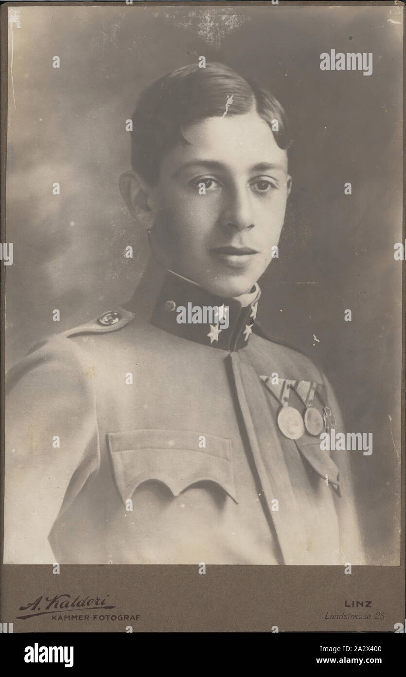 Photograph - Leo Sterne in Military Uniform, Austria, circa 1917, Black and white studio portrait mounted on cardboard, depicting Leo Stern as a young man dressed in Austrian military uniform circa 1917. This photograph relates to the lives of Leo and Hilda Sterne prior to their migration to Australia from Linz, Austria in 1939, joining other family members who had arrived in 1938. The Sternes (originally Sternschein), listed as 'stateless', were probably Stock Photo