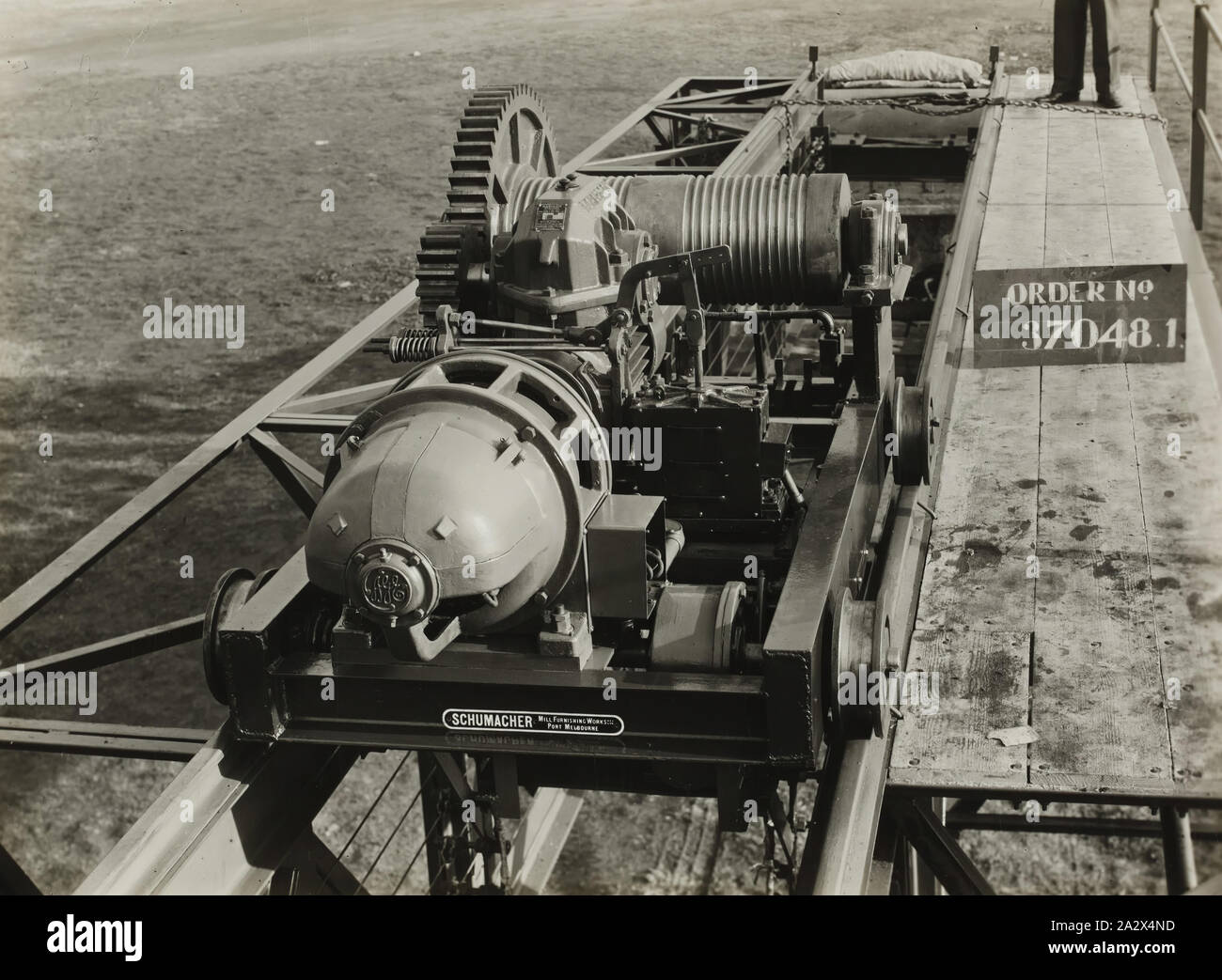 Photograph - Schumacher Mill Furnishing Works, 60 Foot Span, 4 Ton Travelling Crane, Port Melbourne, Victoria, 1938, Black and white image of a 60 Foot Span, 4 Ton Travelling Crane. It is part of a collection of photographs and marked printer's copy used in the preparation of trade literature promoting products manufactured by the Schumacher Mill Furnishing Works Pty Ltd. The items were originally housed in a wooden filing drawer Stock Photo