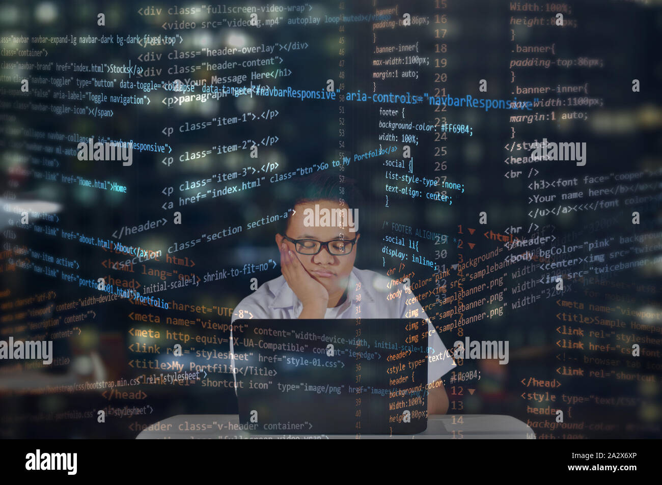 Feeling sleepy at work. Web developer falling asleep while coding. Random HTML codes overlay. Stock Photo