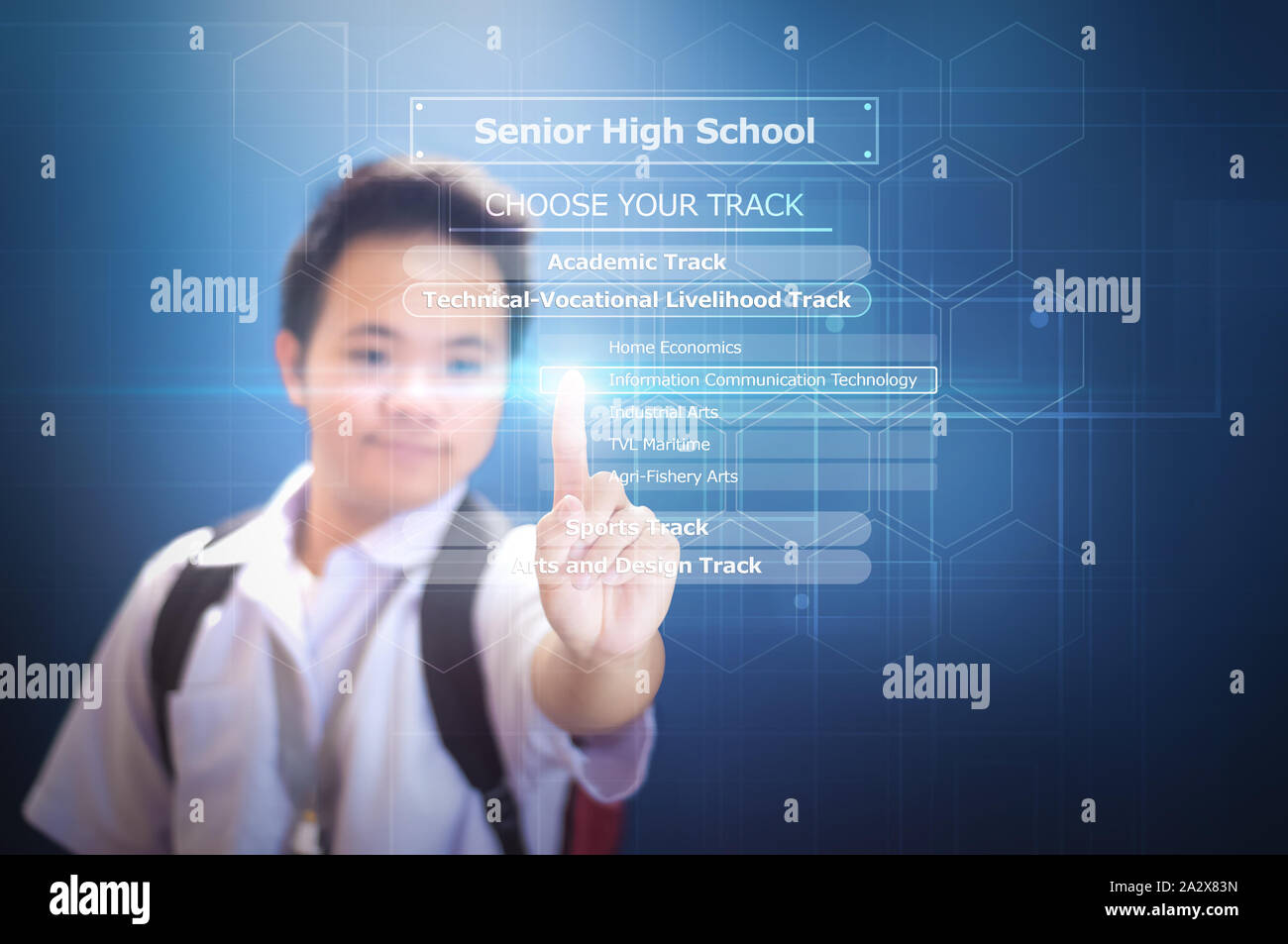 Senior High School Student choosing course using virtual screen  hologram technology on blue background Stock Photo