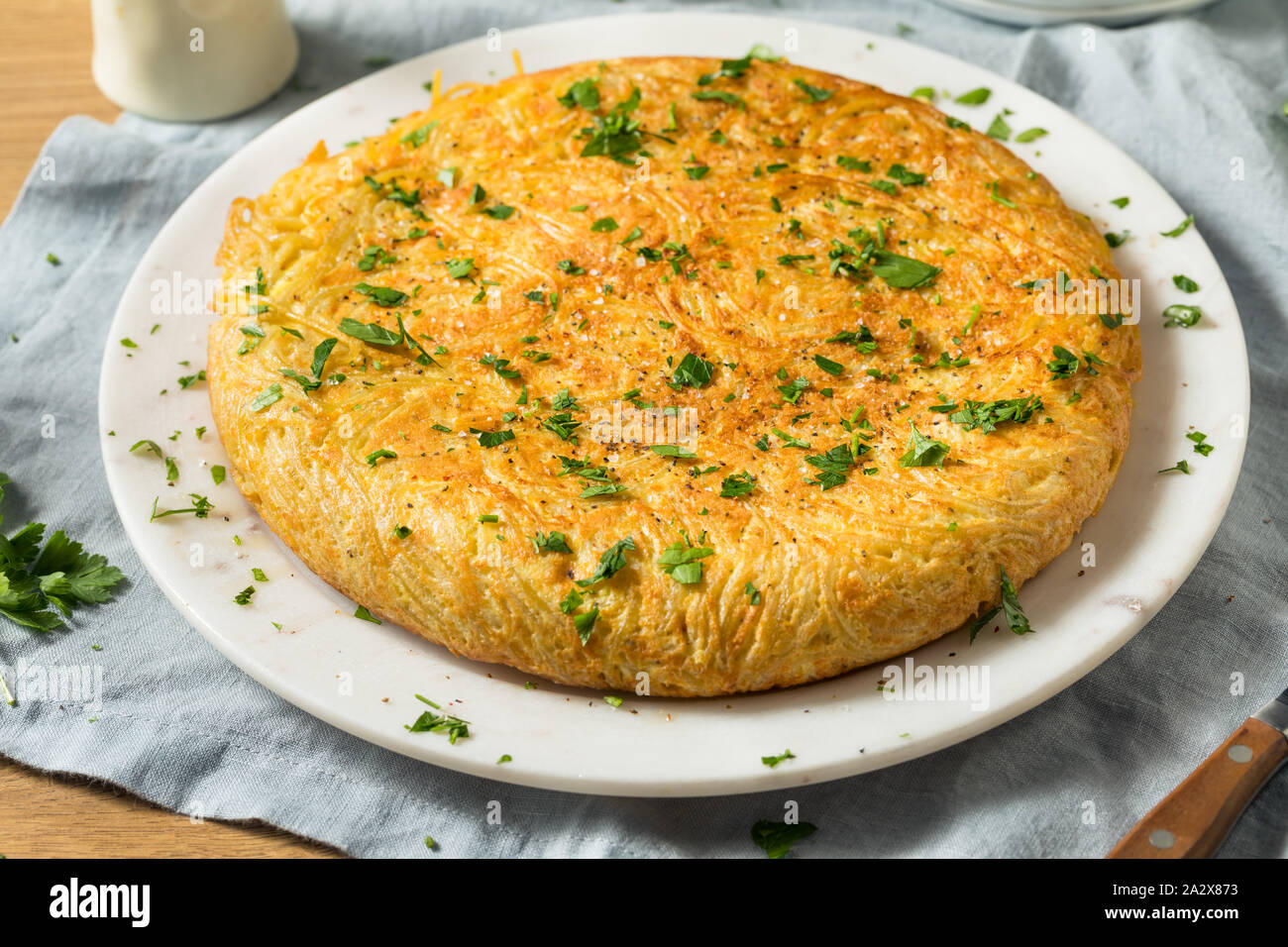 Homemade Spaghetti Omelette with Eggs and Parsley Stock Photo