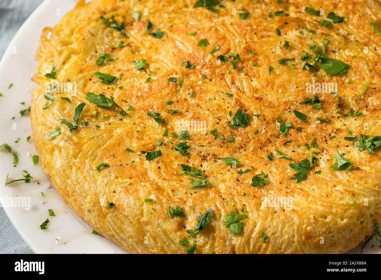 Homemade Spaghetti Omelette with Eggs and Parsley Stock Photo