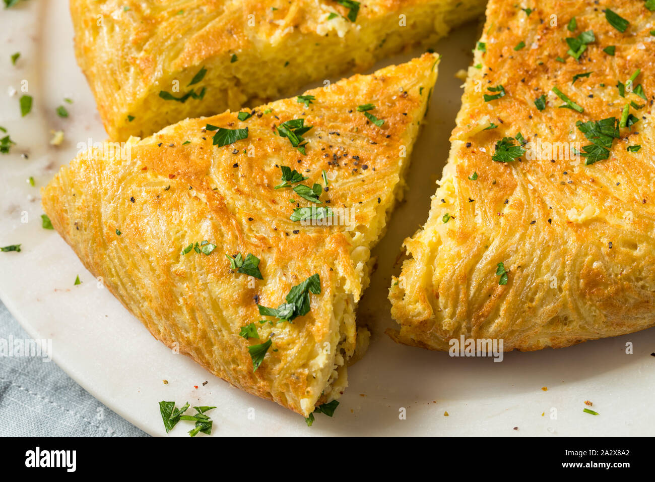 Homemade Spaghetti Omelette with Eggs and Parsley Stock Photo