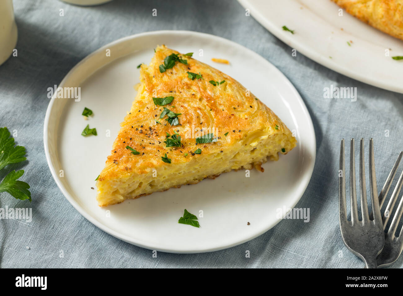 Homemade Spaghetti Omelette with Eggs and Parsley Stock Photo