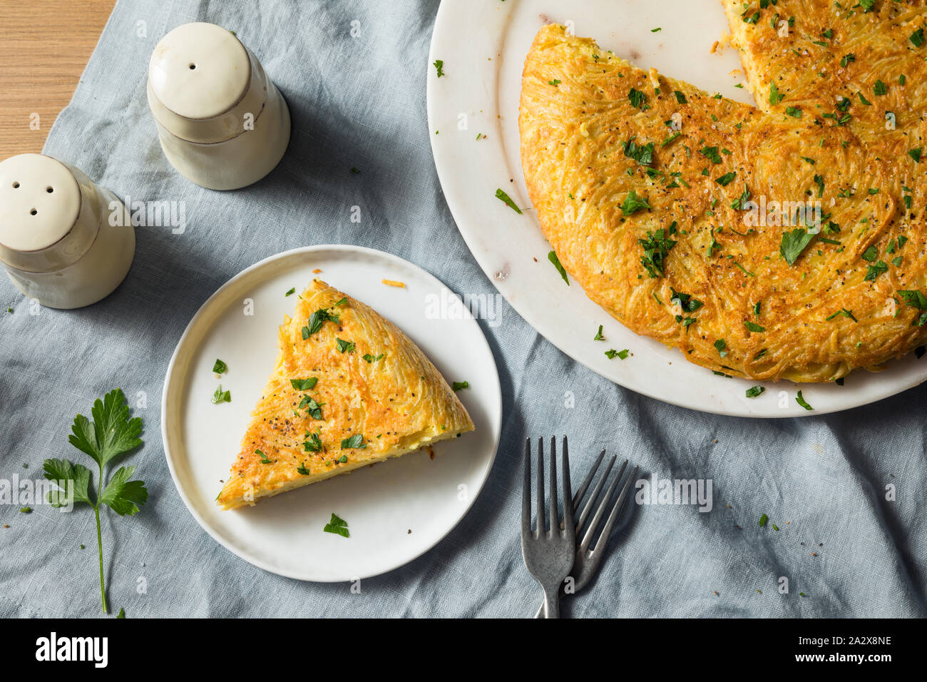 Homemade Spaghetti Omelette with Eggs and Parsley Stock Photo