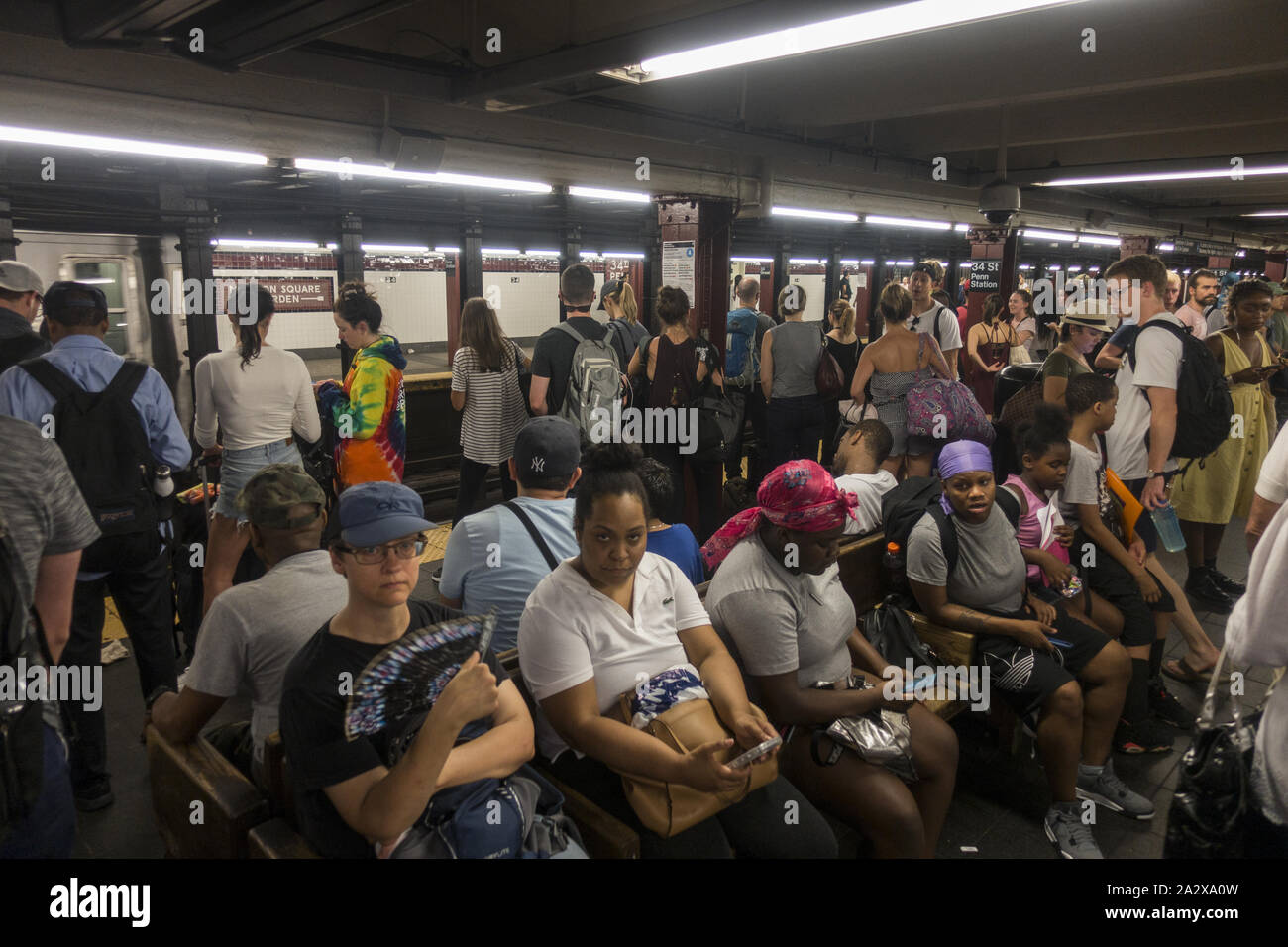 Very crowded 34th Street subway station platform at Penn Station, New ...