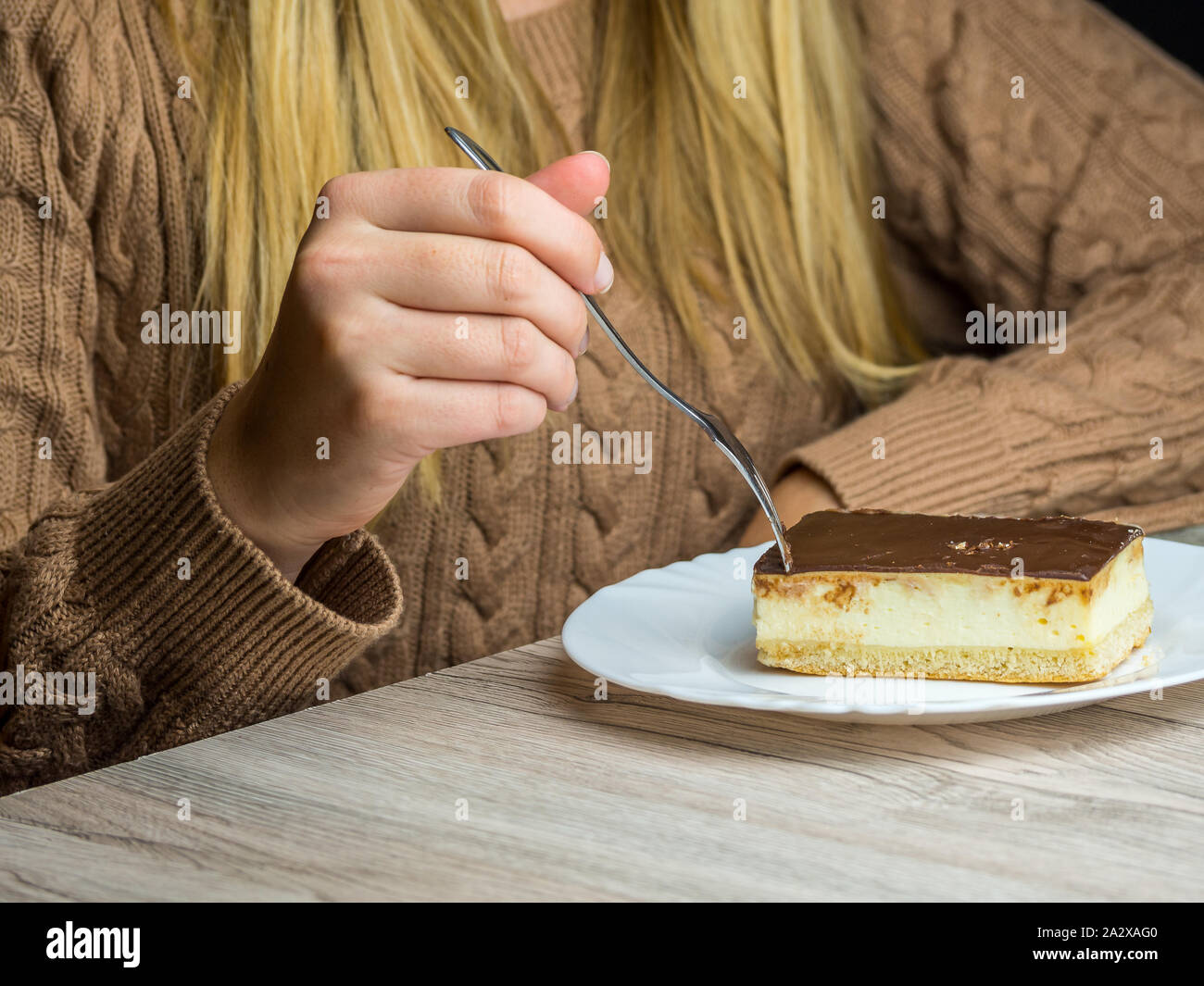 Woman eating cake ill hires stock photography and images Alamy