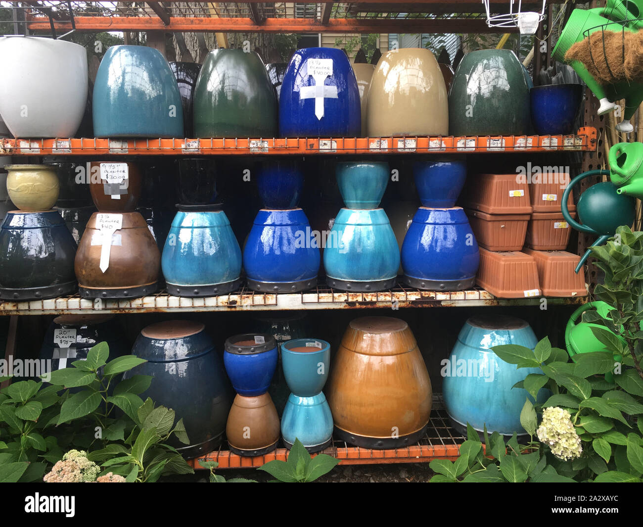 Glazed ceramic pots for plants on display at a garden center in Brooklyn, New York. Stock Photo