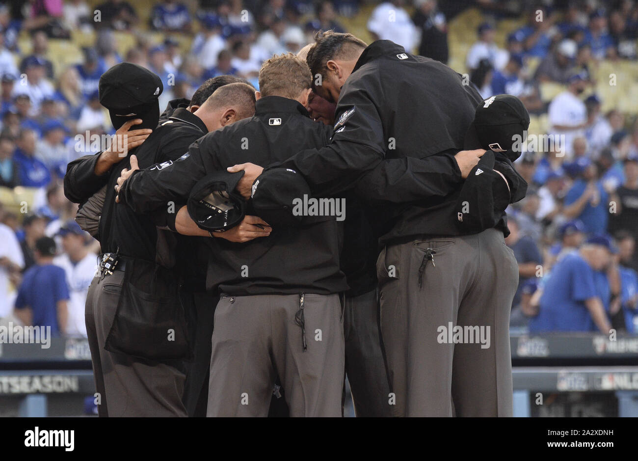 Los Angeles, United States. 03rd Oct, 2019. Umpires gather before the first game of the MLB National League Division Series between the Washington Nationals and the Los Angeles Dodgers at Dodger Stadium in Los Angeles, California on Thursday, October 3, 2019. Photo by Jim Ruymen/UPI Credit: UPI/Alamy Live News Stock Photo