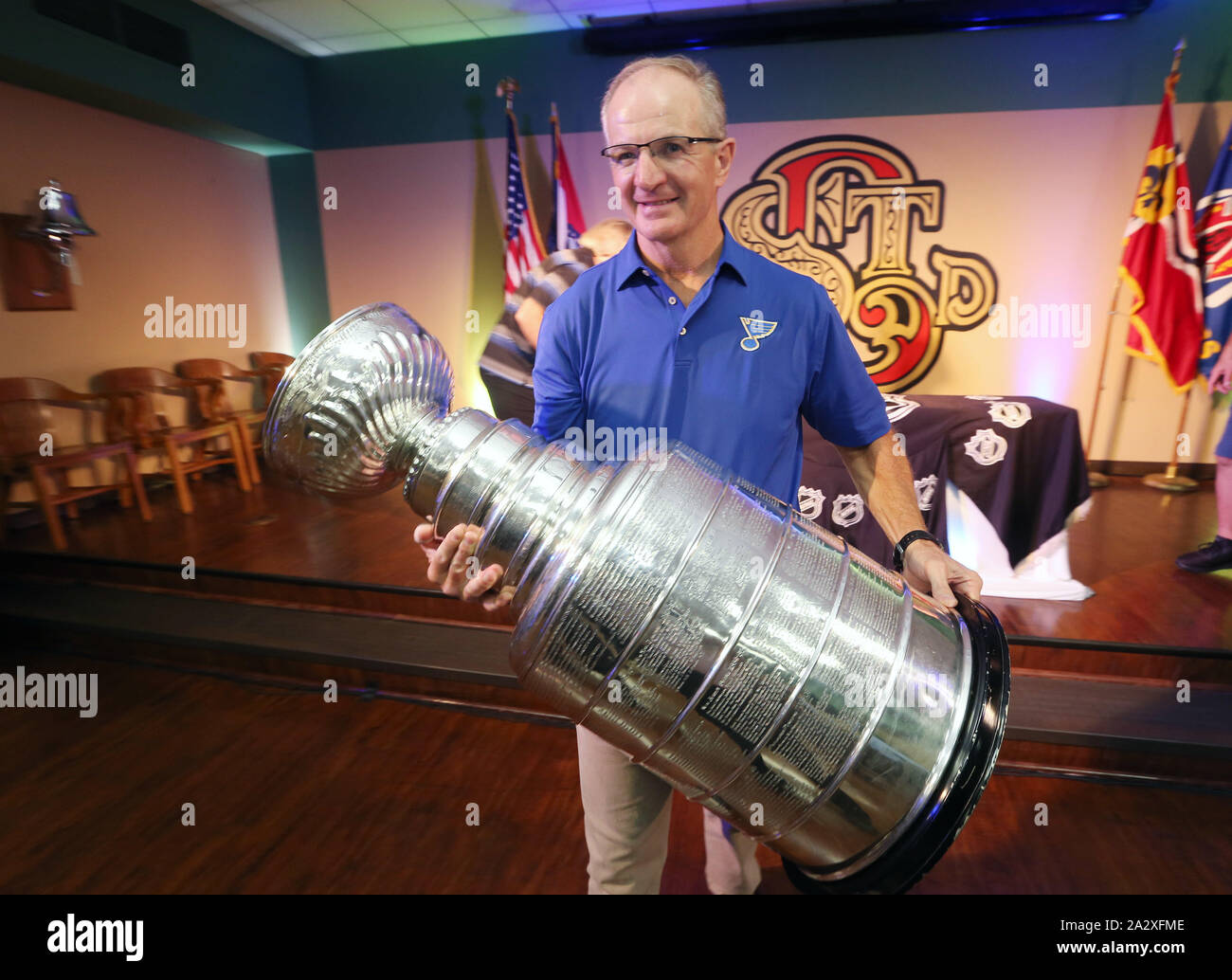 https://c8.alamy.com/comp/2A2XFME/st-louis-united-states-03rd-oct-2019-former-st-louis-blues-defenseman-and-member-of-the-national-hockey-league-hall-of-fame-al-macinnis-carries-the-stanley-cup-after-a-visit-to-the-st-louis-fire-department-headquarters-building-on-thursday-october-3-2019-the-stanley-cup-won-by-the-st-louis-blues-in-june-2019-is-making-a-final-tour-around-the-st-louis-area-before-returning-to-the-hockey-hall-of-fame-photo-by-bill-greenblattupi-credit-upialamy-live-news-2A2XFME.jpg