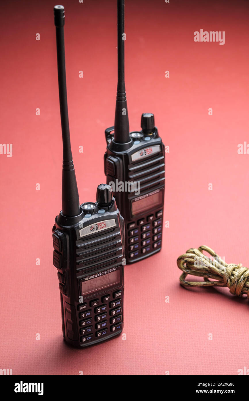 Two way hand held walkie talky radios. Commonly used for public service, business, and personal communications. Stock Photo