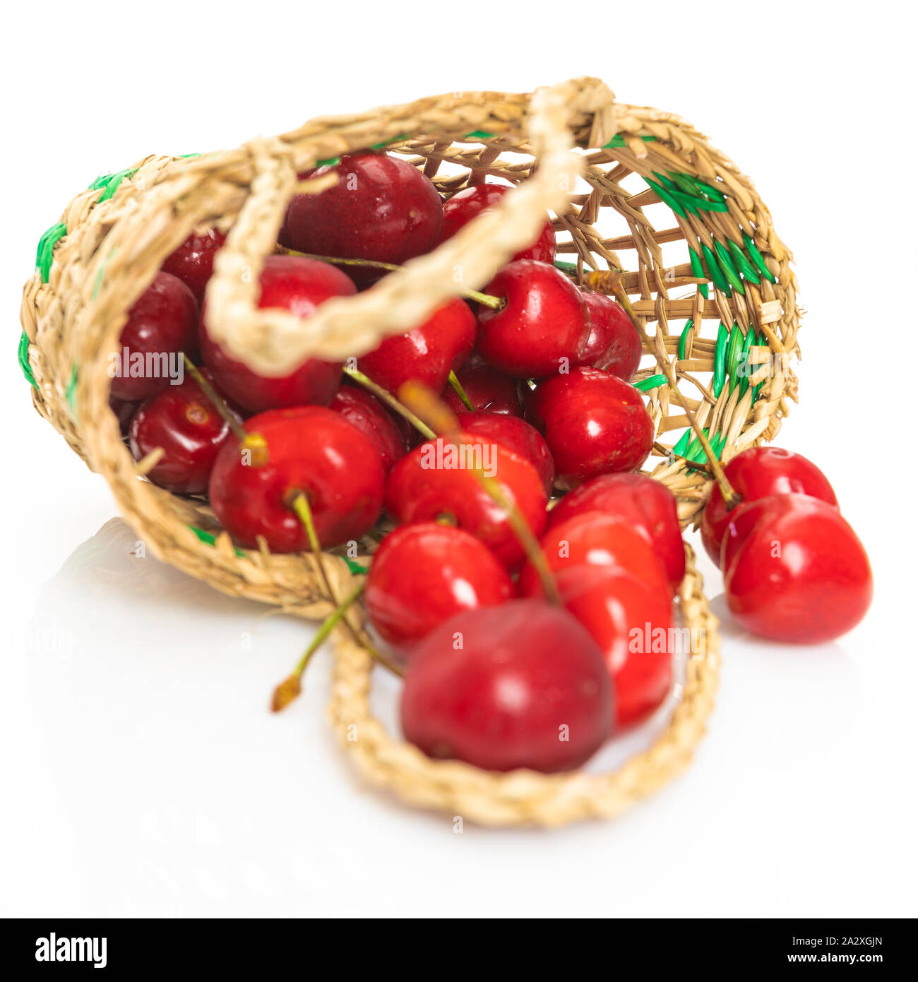 Cherry in basket isolated on a white background Stock Photo - Alamy