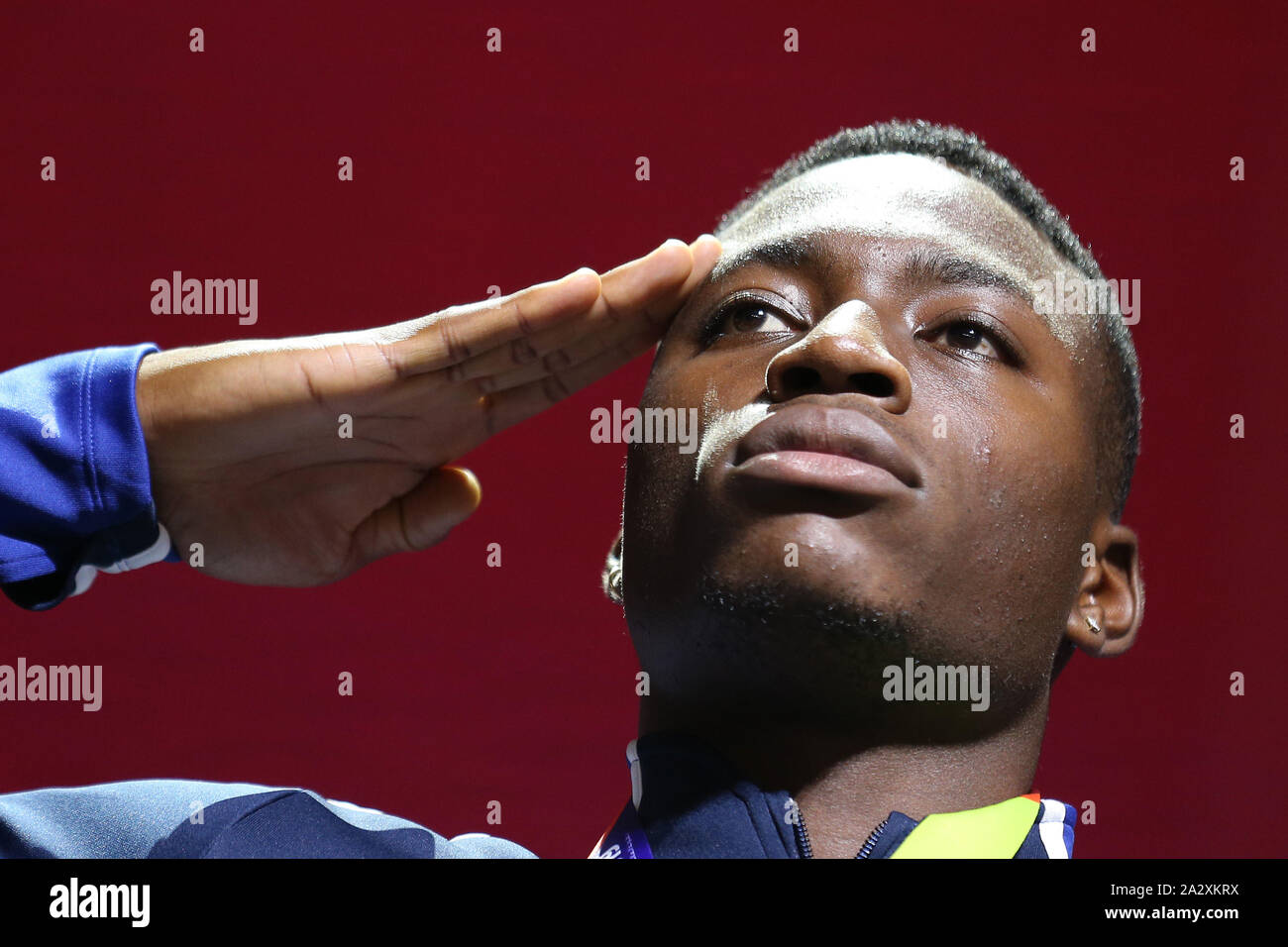 Doha, Qatar. 3rd Oct, 2019. Gold medalist Grant Holloway of the United States salute during the medal ceremony of the men's 110m at the 2019 IAAF World Athletics Championships in Doha, Qatar, Oct. 3, 2019. Credit: Li Ming/Xinhua/Alamy Live News Stock Photo