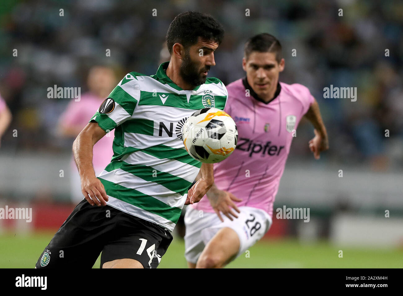 Lisbon, Portugal. 3rd Oct, 2019. Luis Neto (L) of Sporting CP vies with Dominik Frieser of LASK Linz during the UEFA Europa League group D match between Sporting CP and LASK Linz in Lisbon, Portugal, on October 3, 2019. Credit: Pedro Fiuza/Xinhua/Alamy Live News Stock Photo