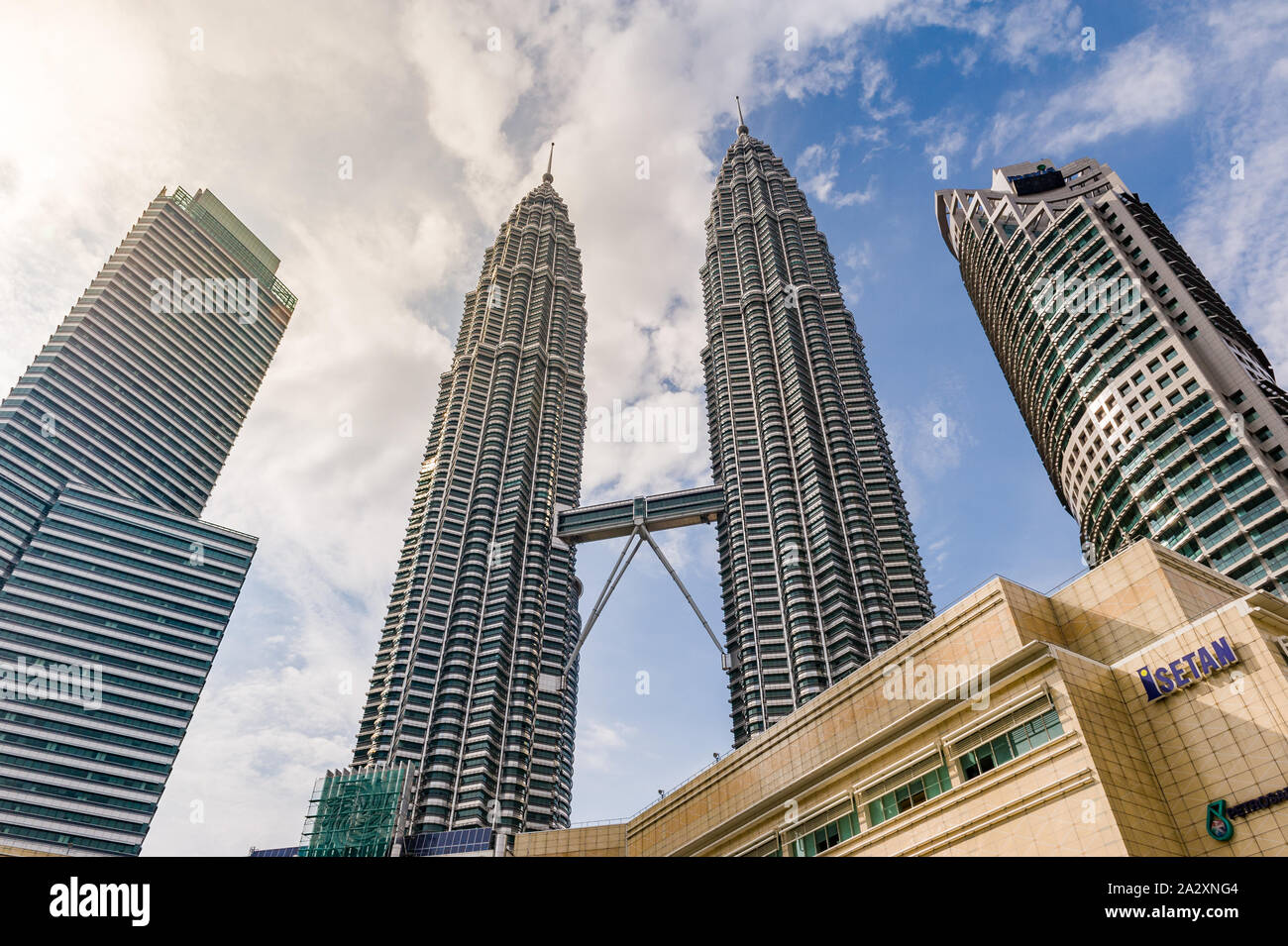 Kuala Lumpur, Malaysia, 17 Nov 2013: Famous landmark towering Petronas Twin Towers with blue sky. Stock Photo