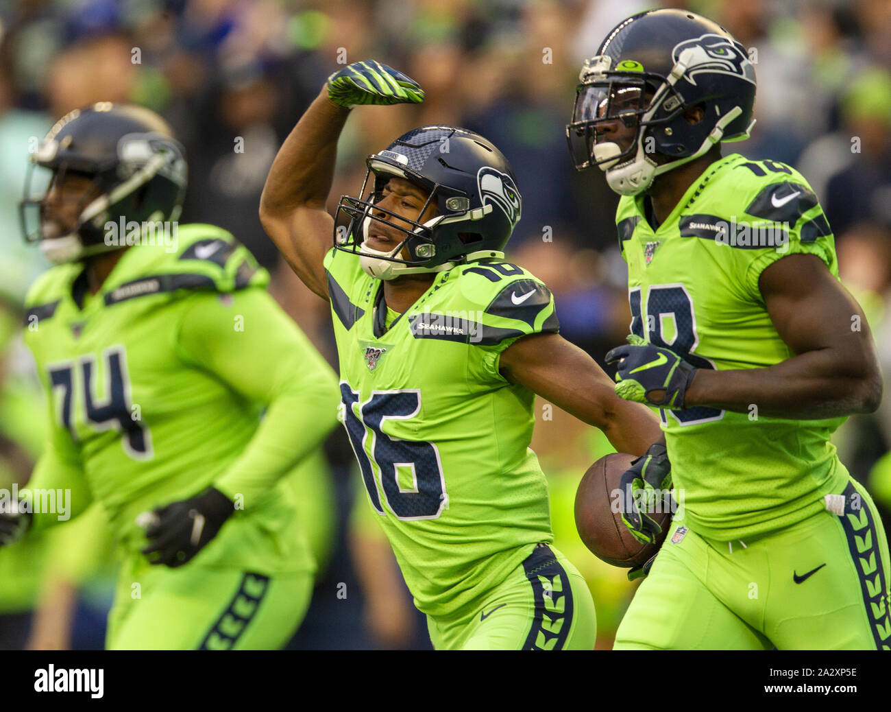 Seattle Seahawks wide receiver Tyler Lockett (16) is wrapped by Los Angeles  Rams Kickoff team during the first quarter at CenturyLink Field on October  7, 2018 in Seattle, Washington. The Rams beat