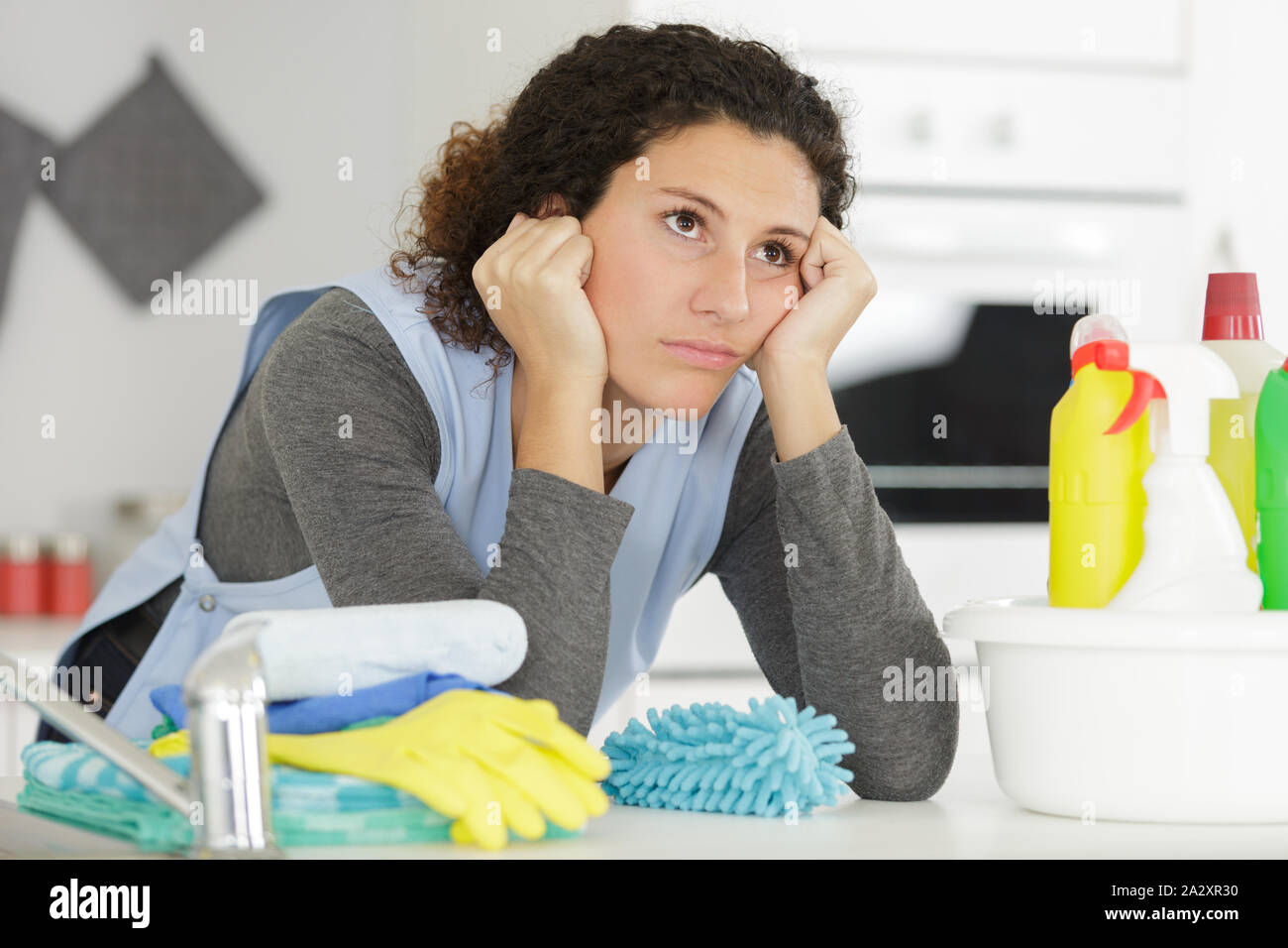 tired young woman after housework Stock Photo - Alamy