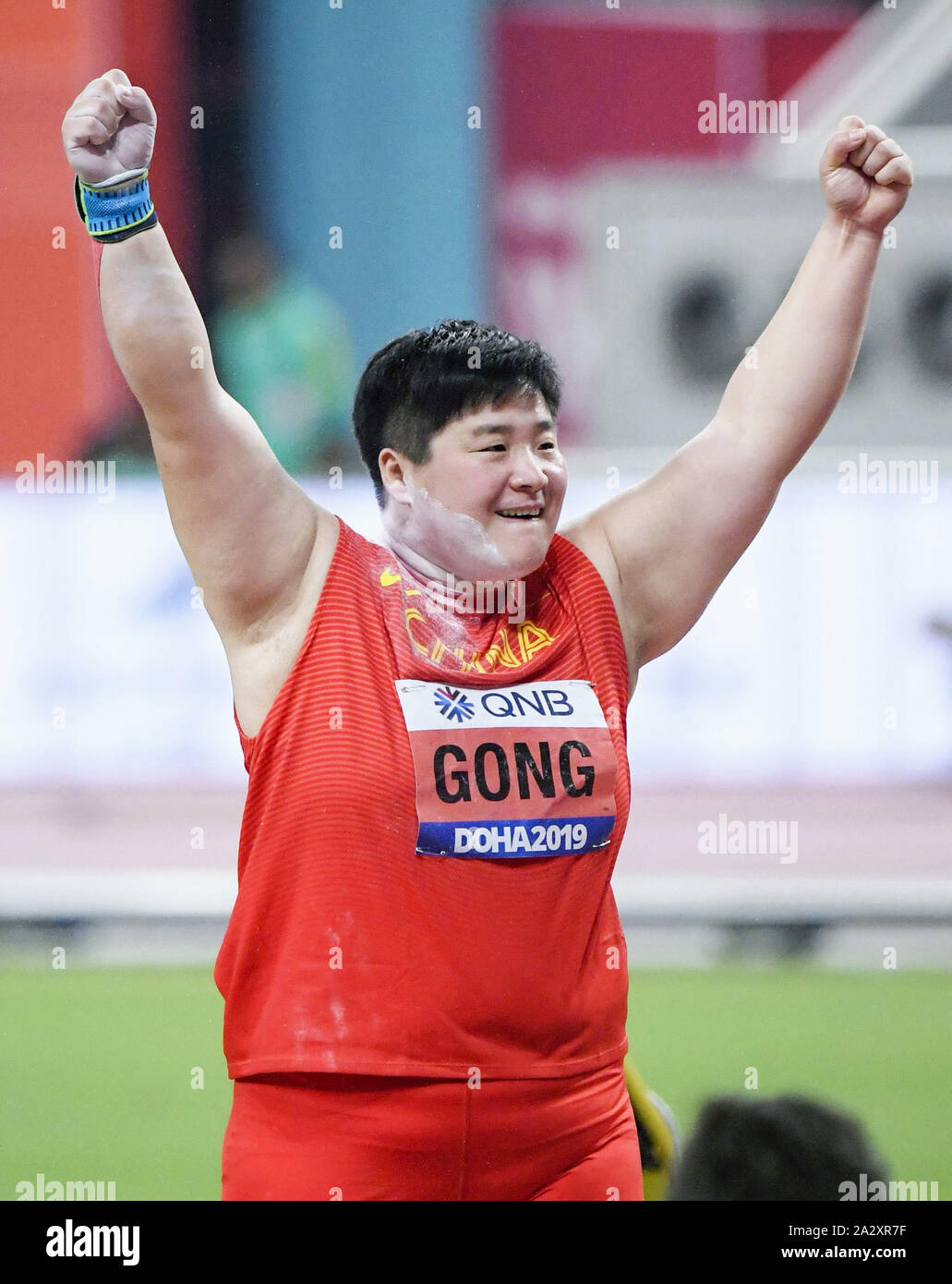 Reigning champion Gong Lijiao of China celebrates after winning the