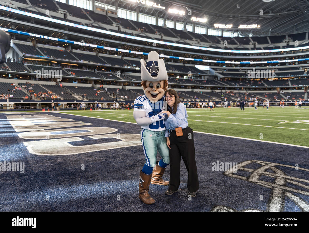 Rowdy, an ever-smiling buckaroo, has been the official mascot of the Dallas Cowboys of the National Football League since 1996. Here he welcomes photographer Carol M. Highsmith to the Cowboys' home field, AT&T Stadium, in Arlington, Texas Stock Photo
